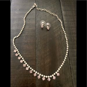 Silver, rhinestone and amethyst costume jewelry.